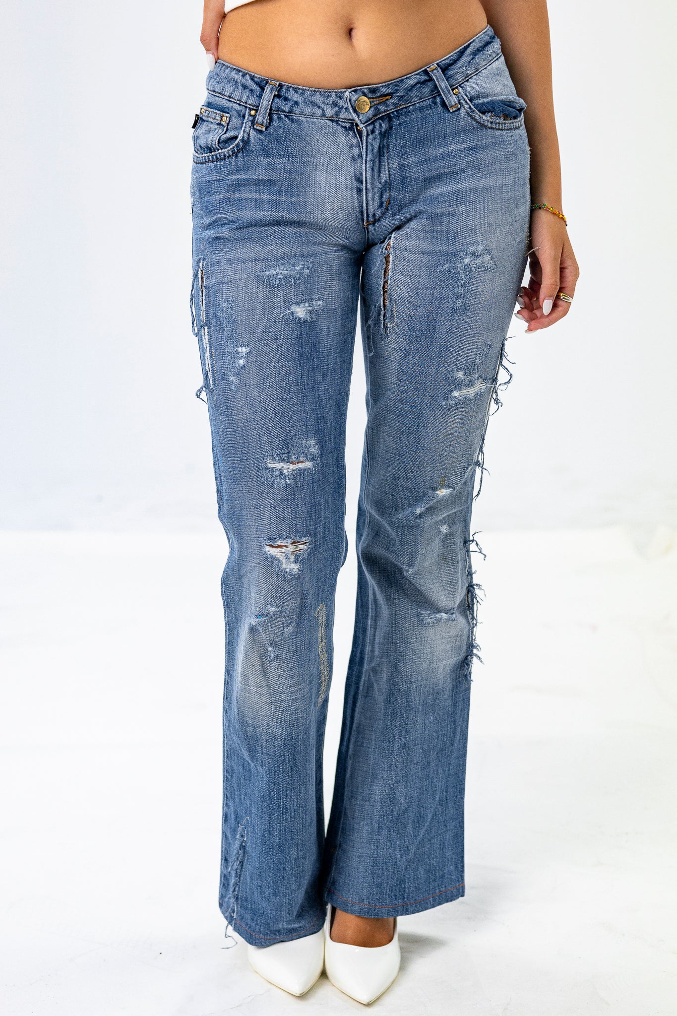 Low-Rise Ripped Jeans with Cut-out detail under Cheek